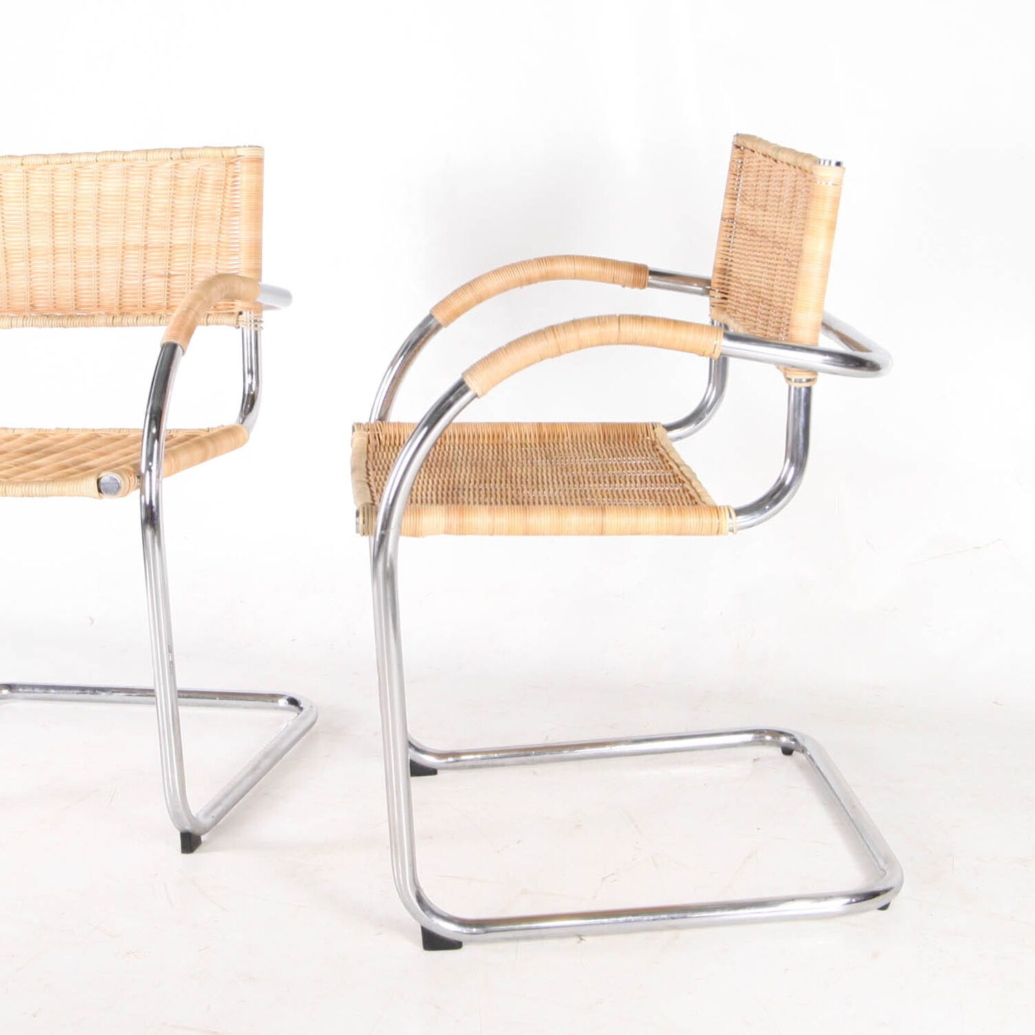 Pair of wicker and metal armchairs