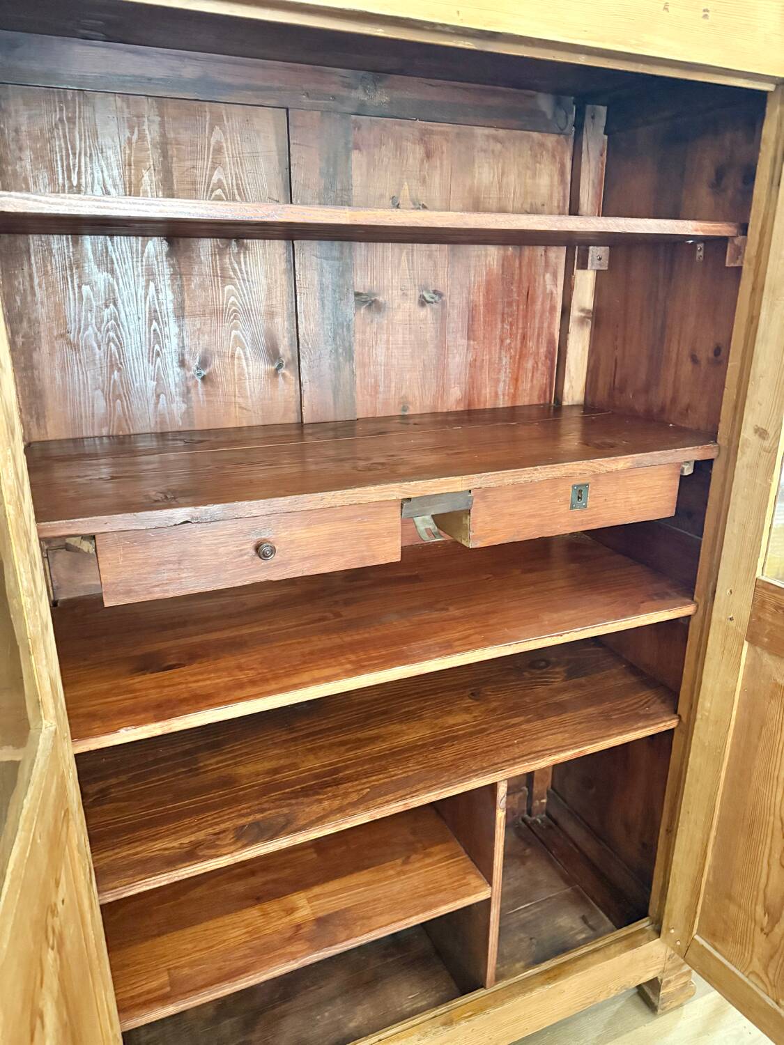 Glass-fronted cabinet in solid wood