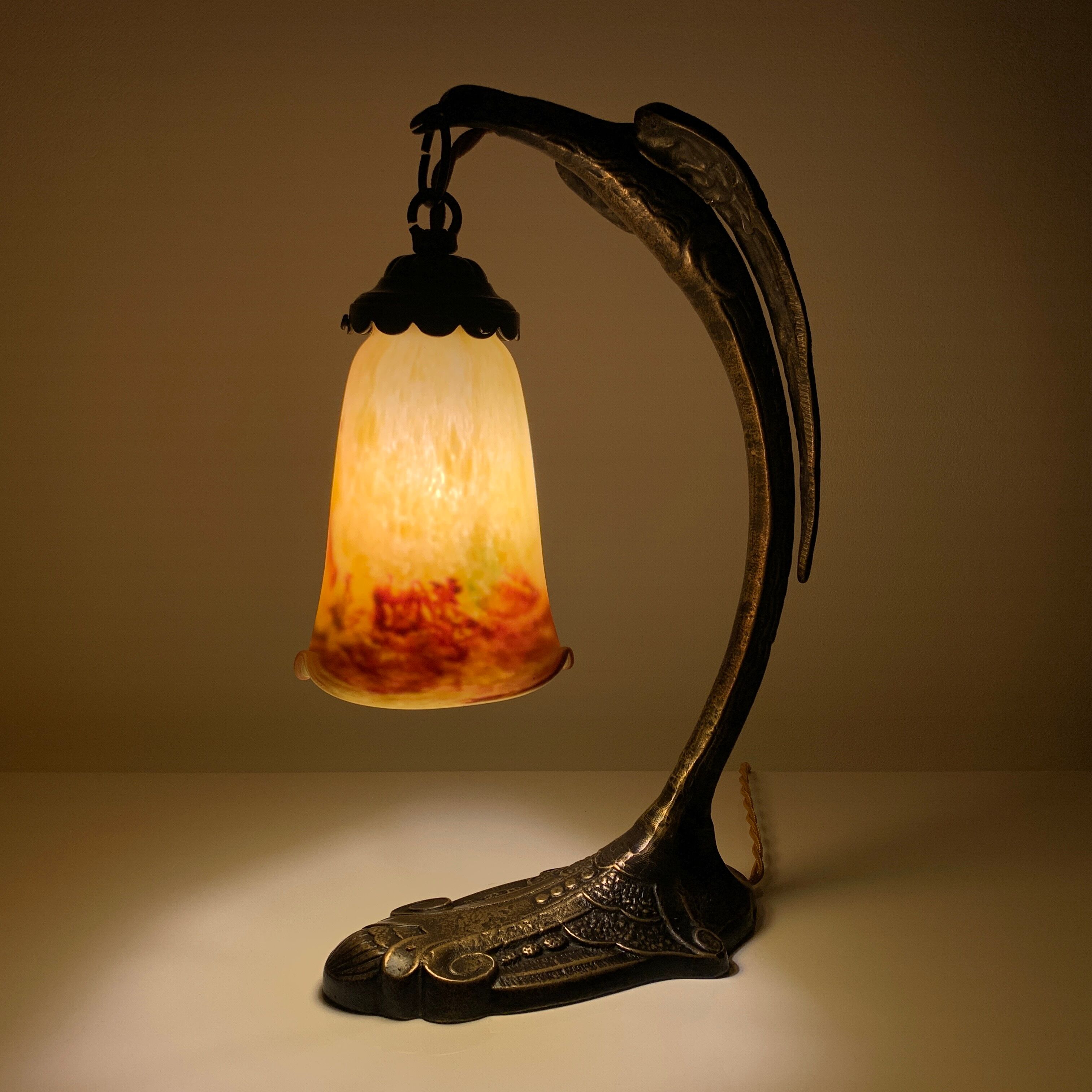 Bronze eagle lamp patinated and Art Nouveau style glass pate