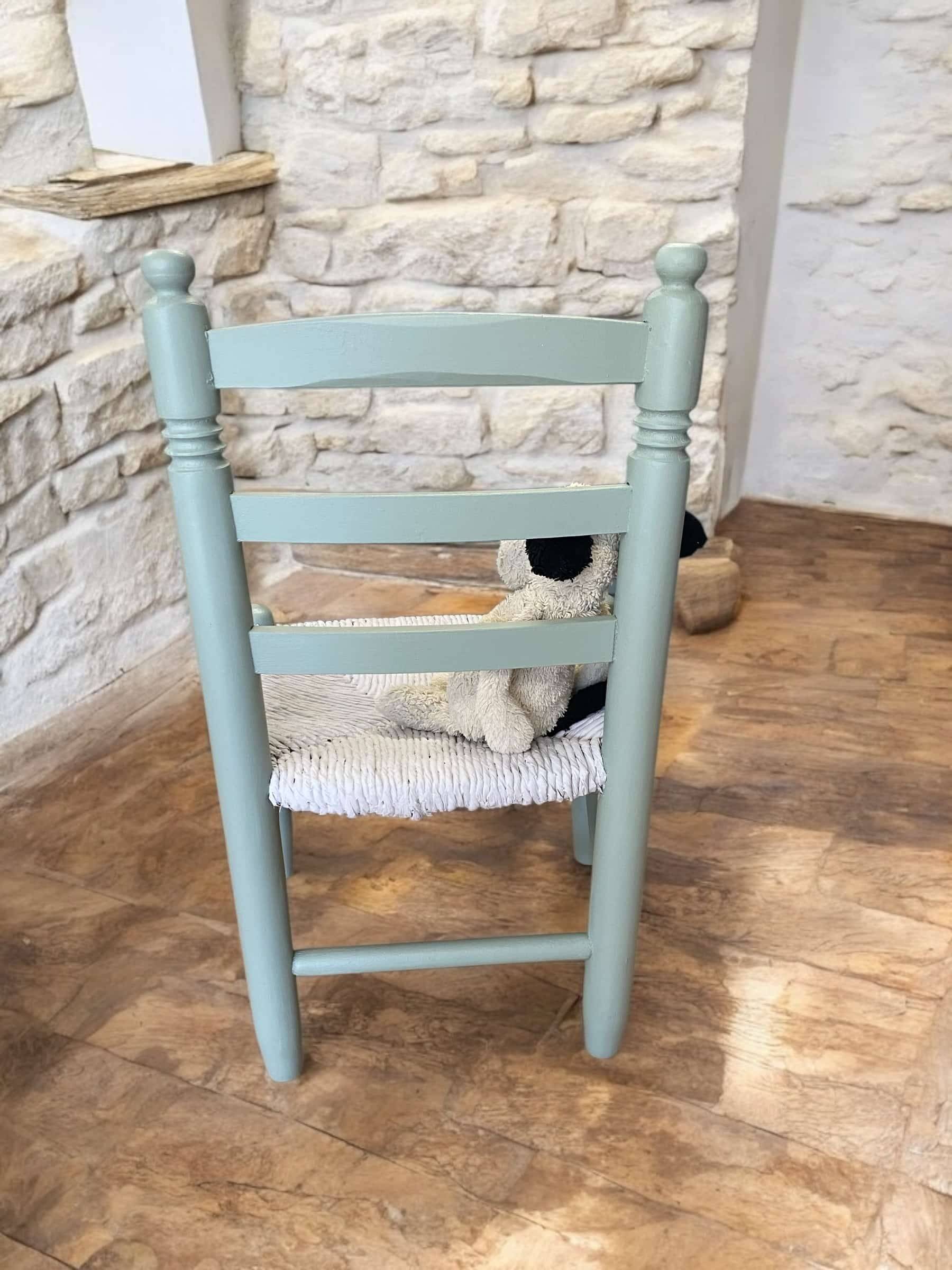 Child's chair in wood and straw revamped in almond green and white.