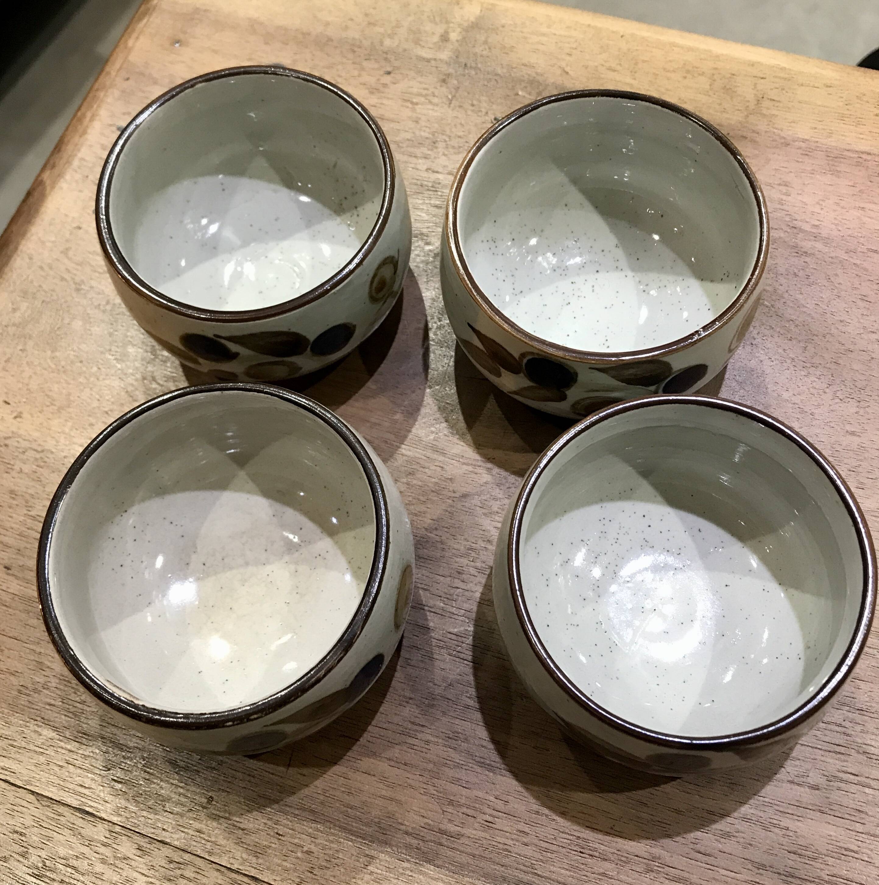 Enamelled stoneware tea bowls with plant decor