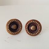 Pair of antique furniture knobs in gilded brass.