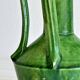 Pottery green ceramic vase with four handles.