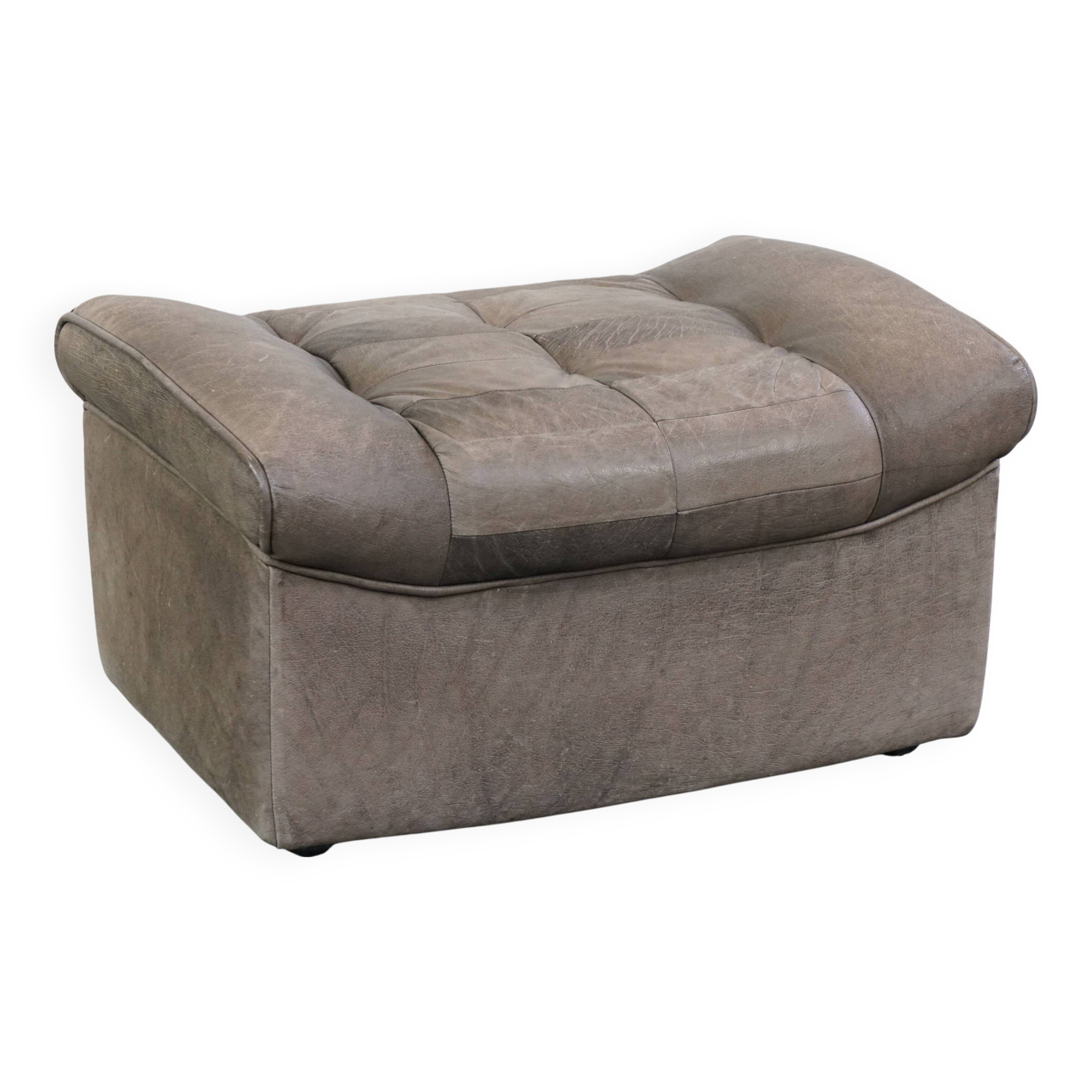 Luxurious, comfortable, gray leather vintage footstool