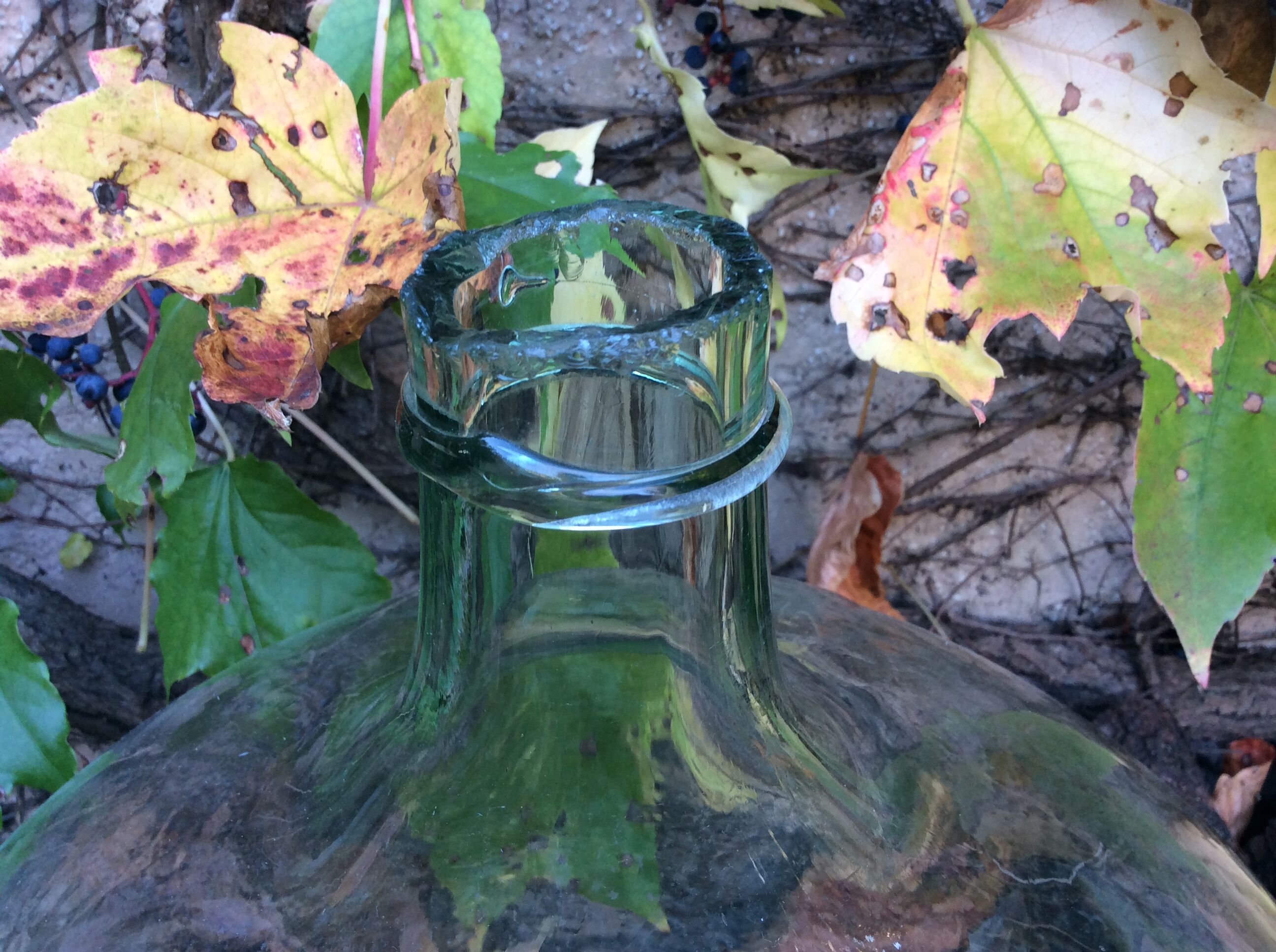 An old "Dame-jeanne" in blown glass, beginning of the nineteenth century