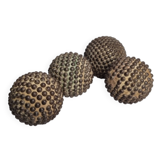 Set of four old studded wooden Lyonnaise balls