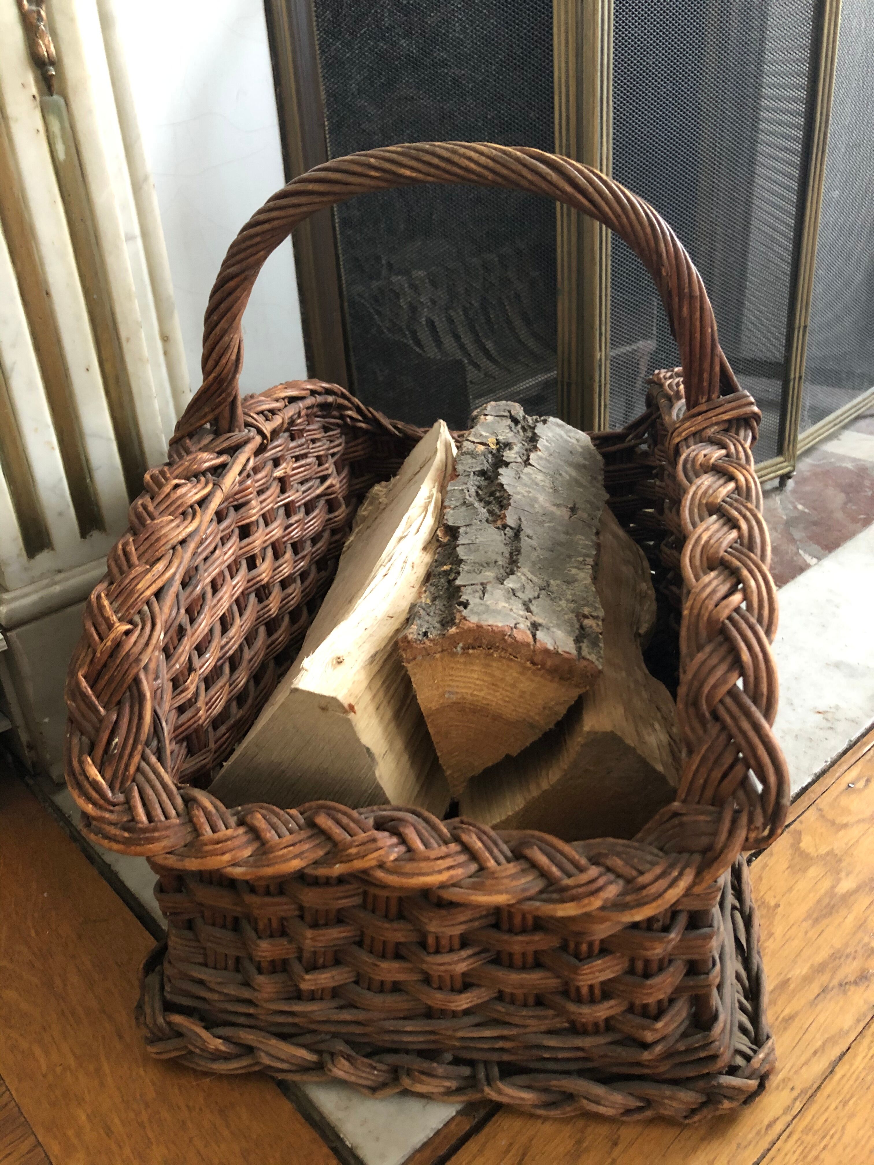 Log basket near fireplace