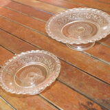 Duo of molded glass display cups, arabesque décor