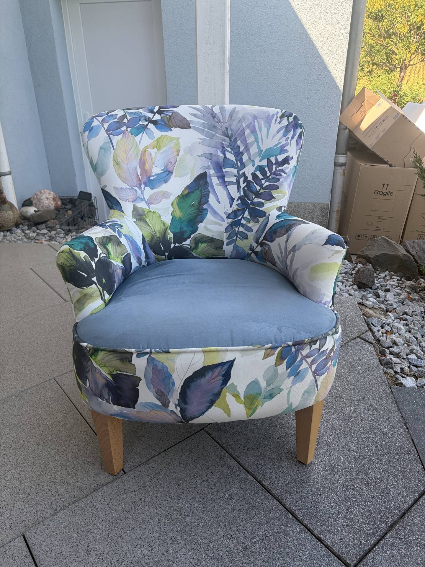 Contemporary ALC frog chair, reupholstered in watercolour floral fabric.