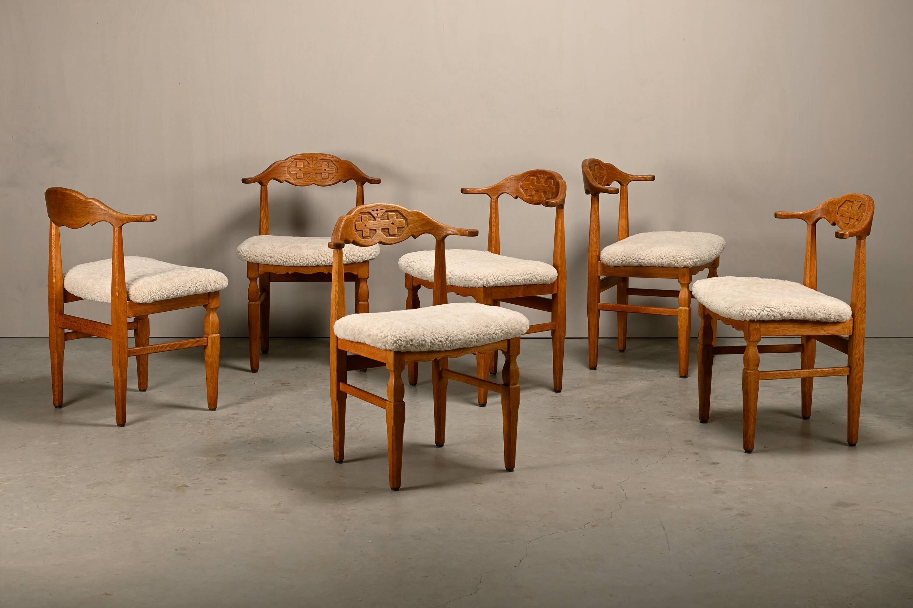 Henning Kjærnulf brutalist dining chairs set in Oak and Sheepskin, Denmark