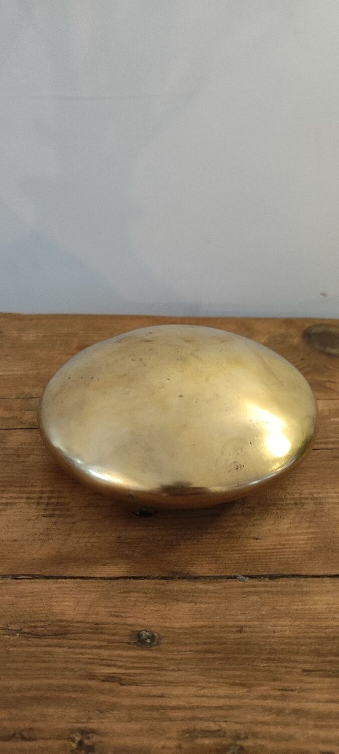 Modernist ashtray pellet in solid bronze.