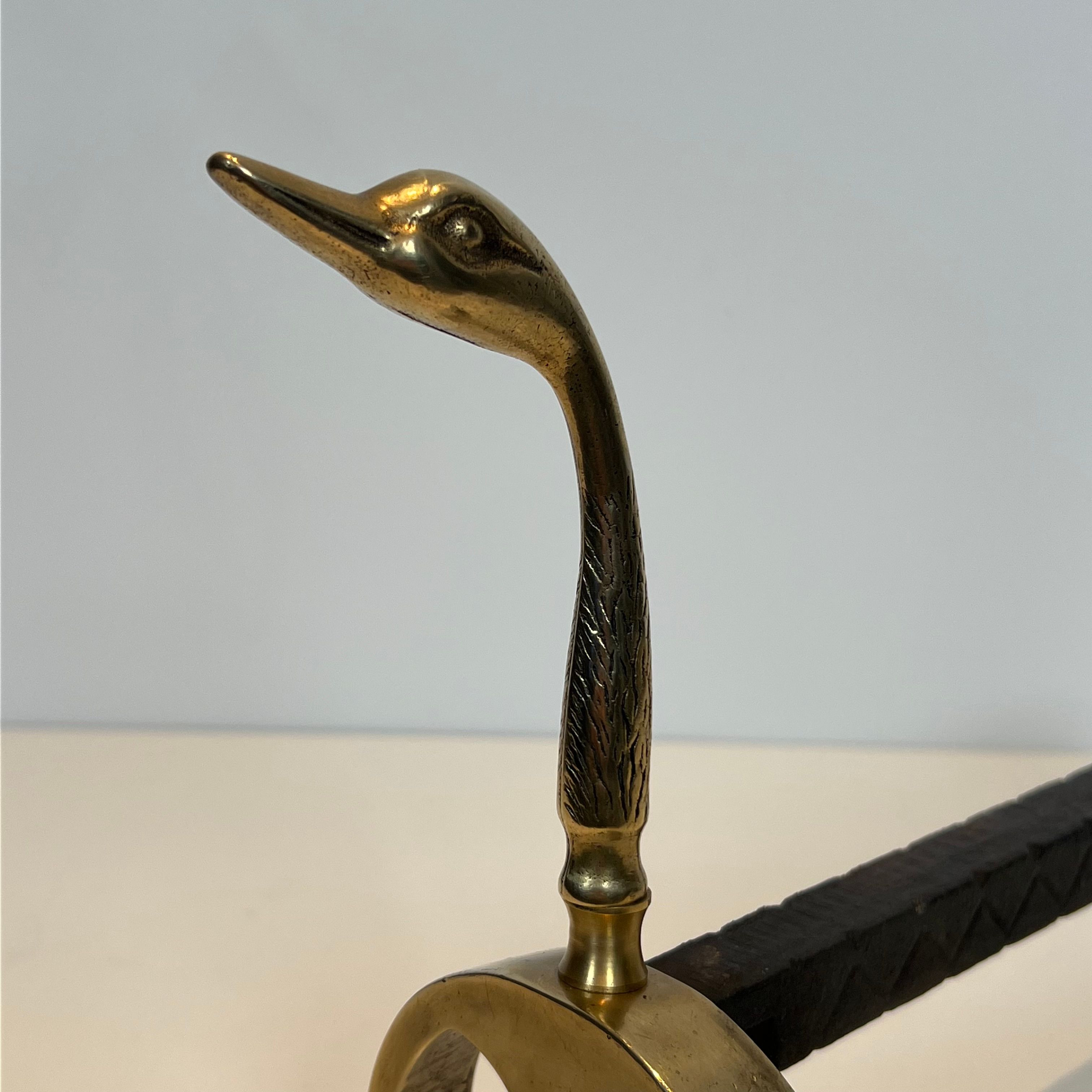 Pair of brass andirons with ducks. In the style of Maison Jansen.