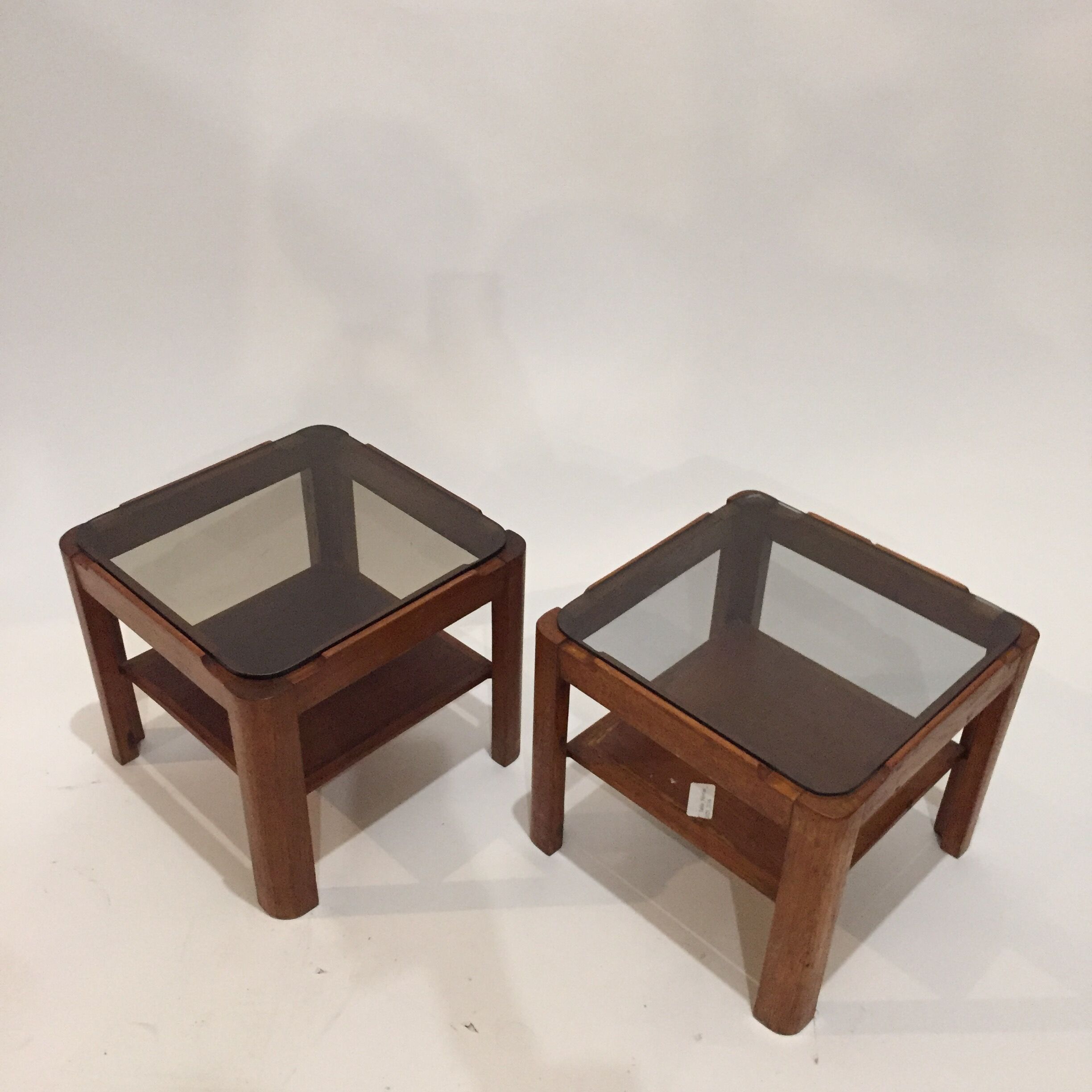Pair of teak bedside tables and smoked glass