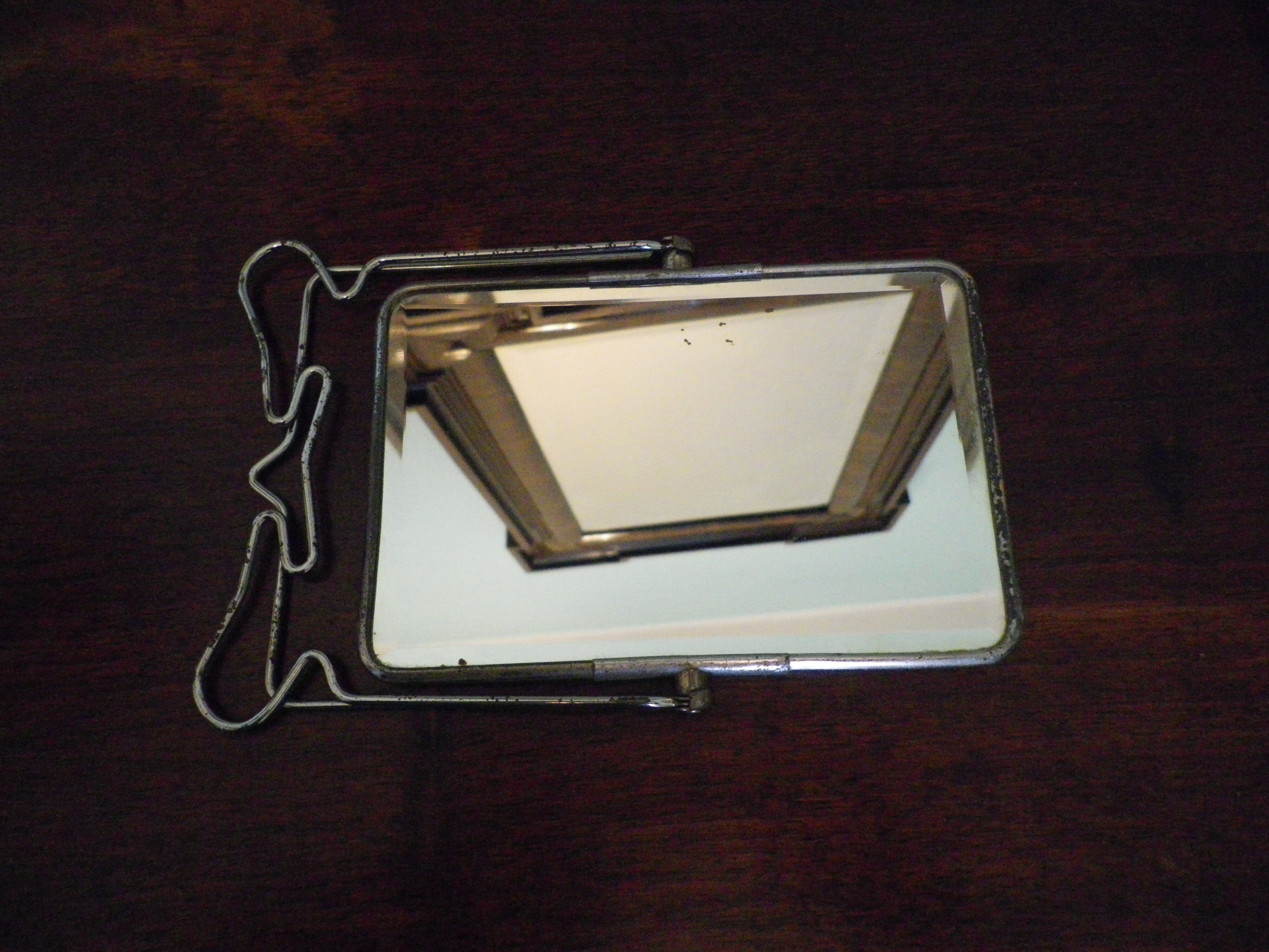 Two-foot barber mirror, suspension mode, beveled, chrome metal - 70s -