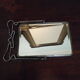 Two-foot barber mirror, suspension mode, beveled, chrome metal - 70s -