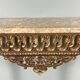 Louis XVI style console in carved wood with a gilded patina, 19th century.