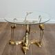 Coffee table model with cranes surrounding a brass bonsai and round glass top by Willy Daro.