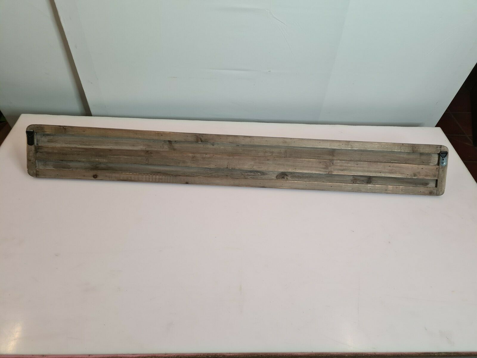 wooden school coat rack and iron hooks