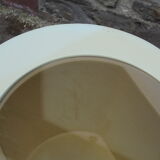 Cylindrical fiberglass bedside table from the 60s