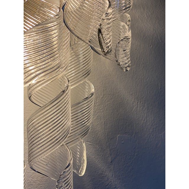 A pair of transparent “ricci” murano glass wall sconces