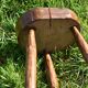Ancient tripod brutalist stool
