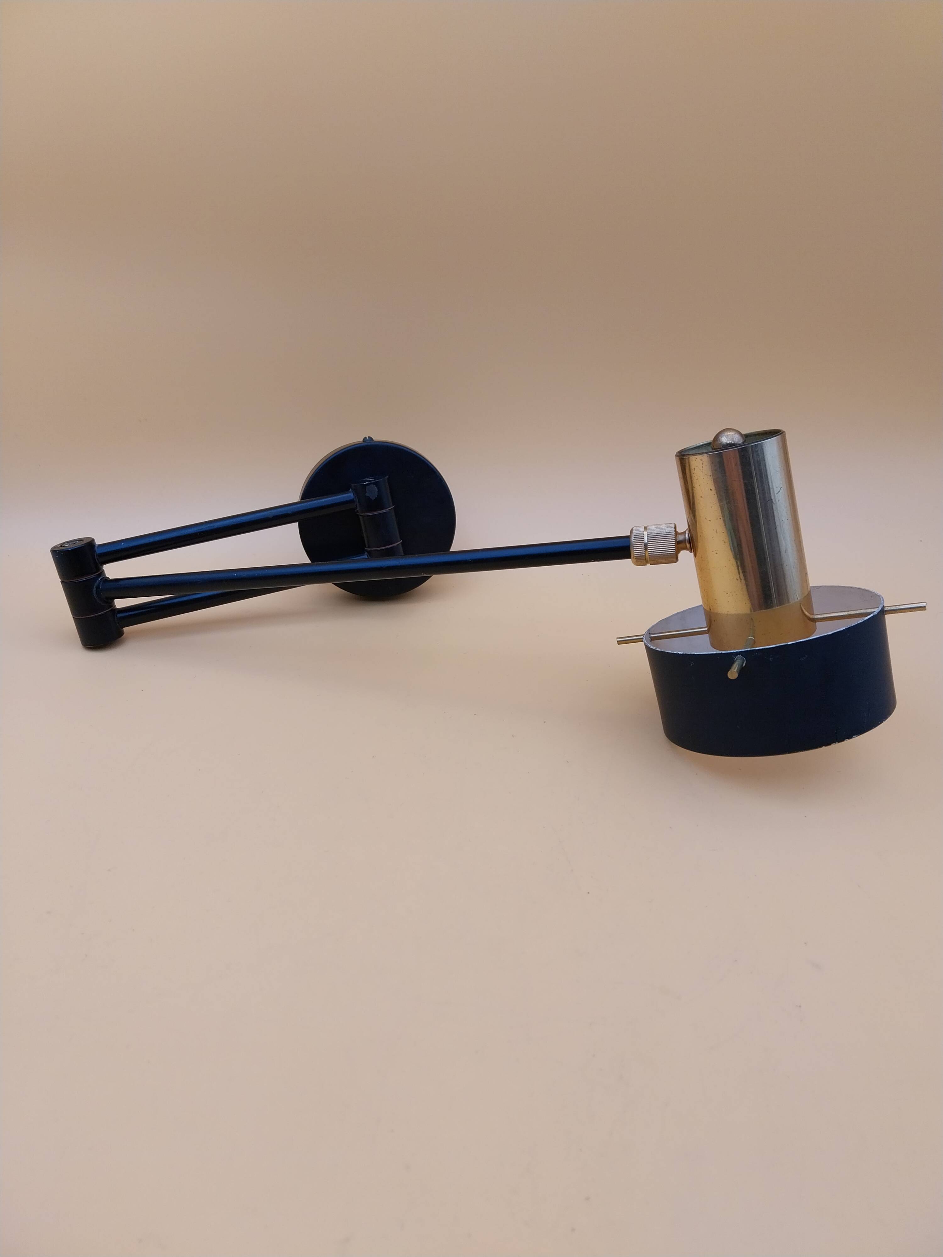 Black metal and brass wall light.