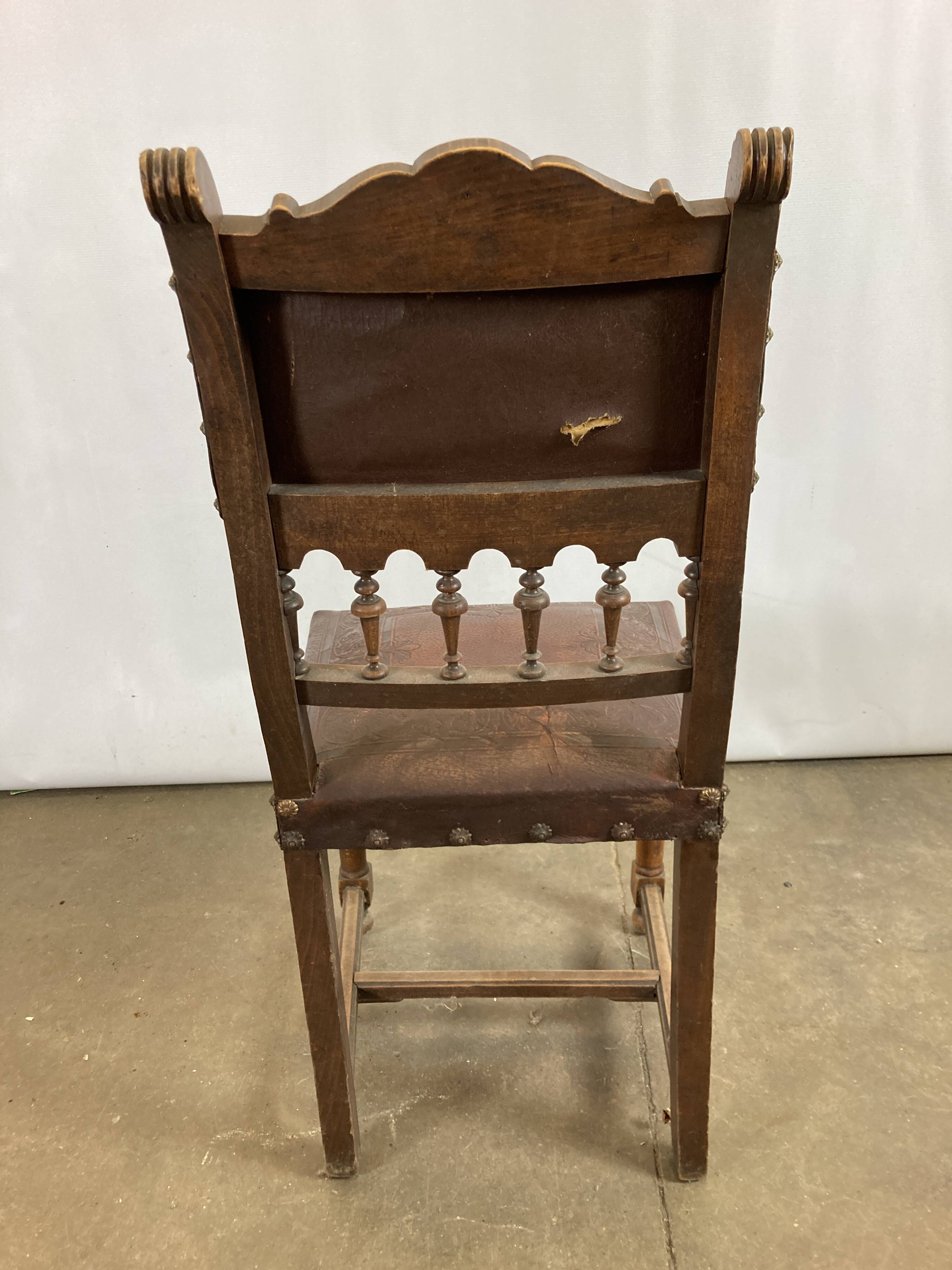 Pair of Henry II wooden and leather chairs