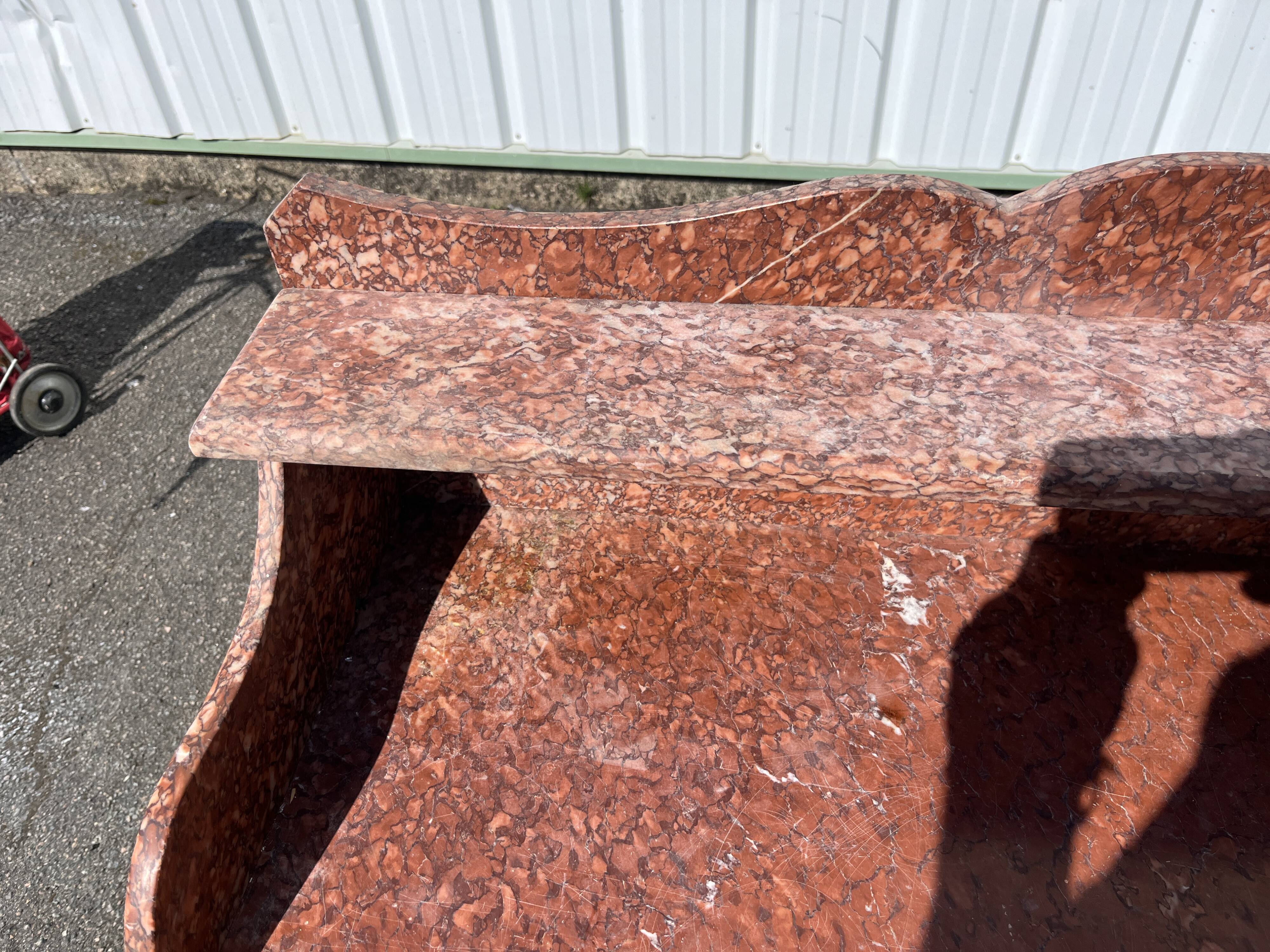 Antique wooden and red marble bathroom cabinet
