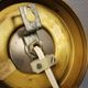 Older wall lamp, in metal, brass and milk-white glass