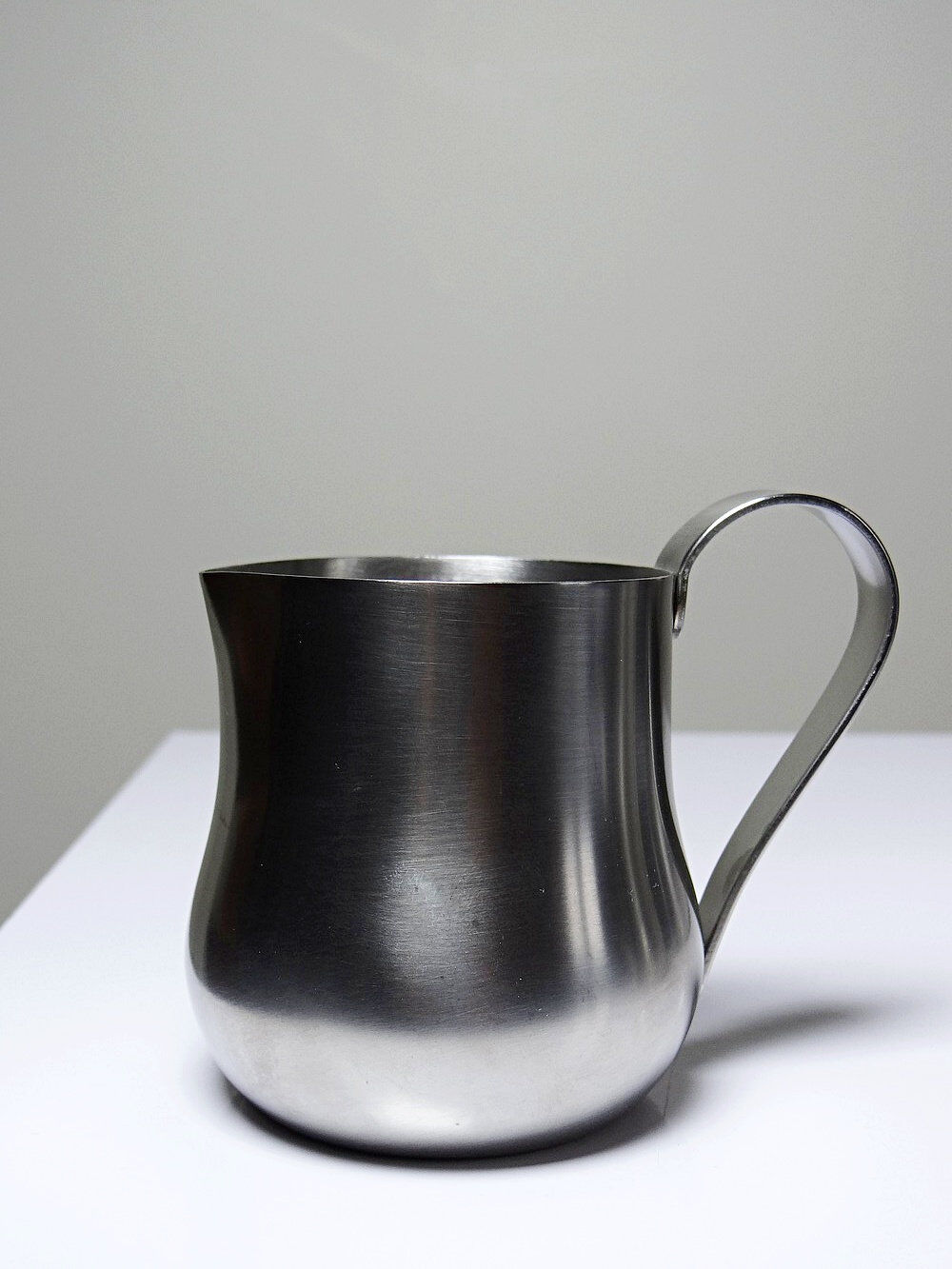 Set of 4 vintage bar measures in brushed stainless steel from the 60s-70s.