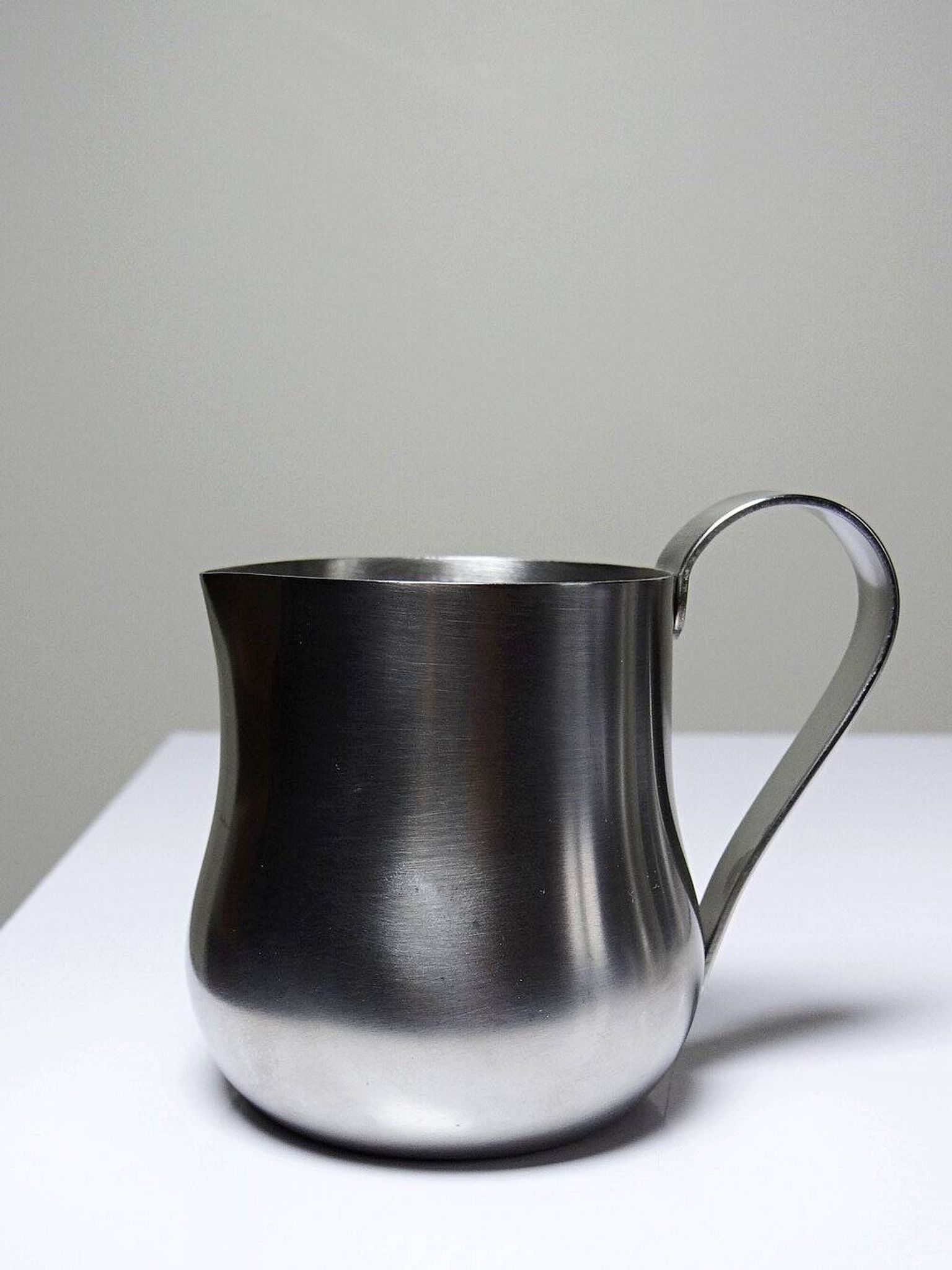Set of 4 vintage bar measures in brushed stainless steel from the 60s-70s.