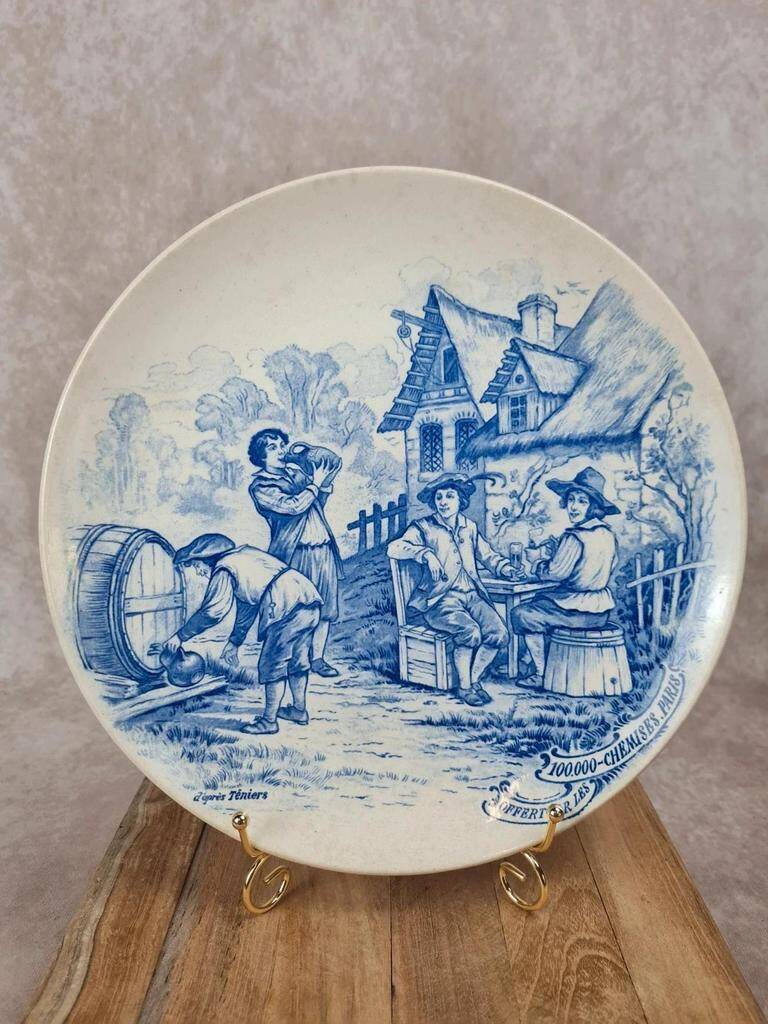 Old advertising plate with blue decoration after Teniers – 100,000 Shirts Paris