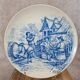 Old advertising plate with blue decoration after Teniers – 100,000 Shirts Paris