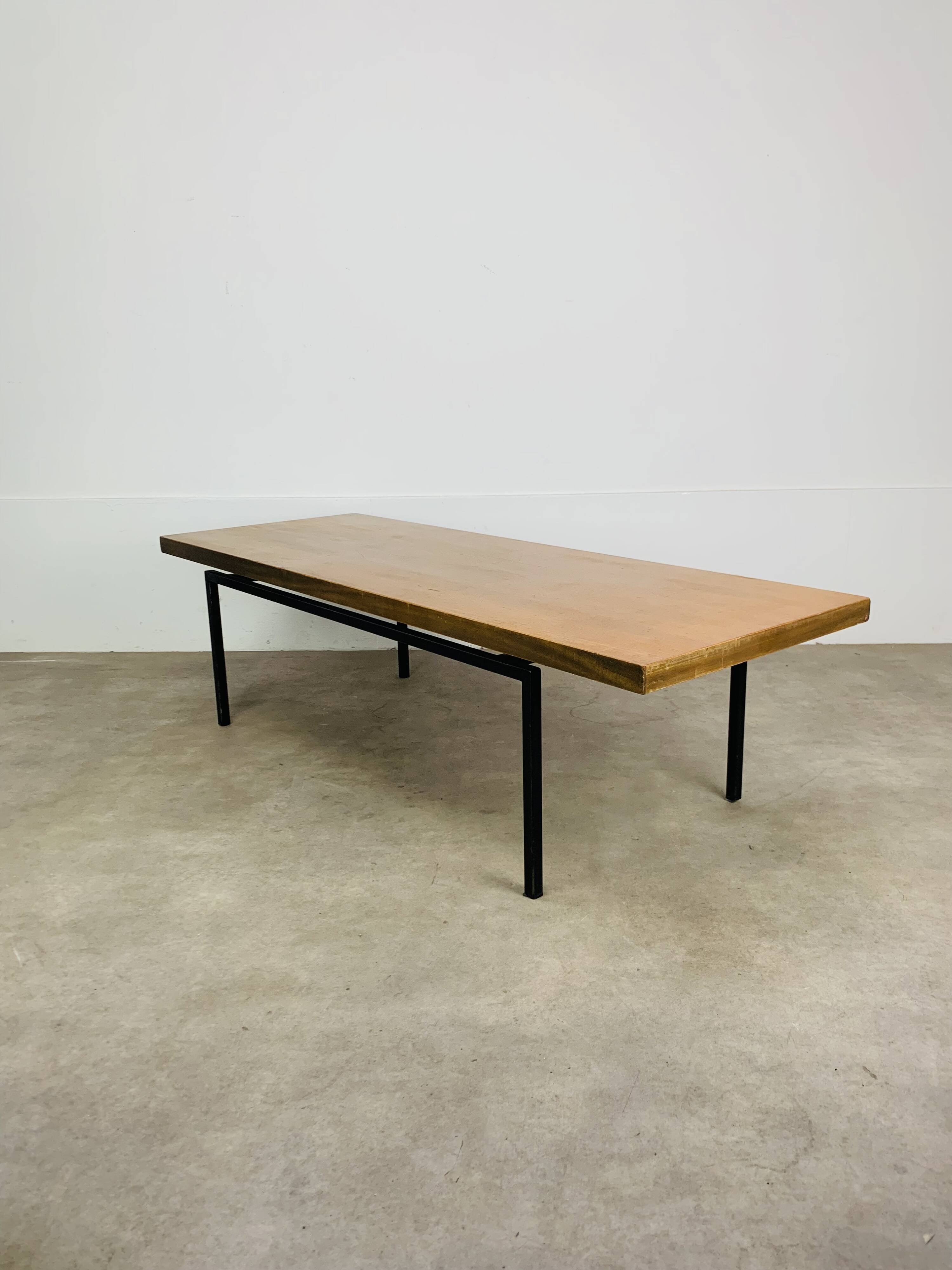 1950s modernist coffee table, wood and black metal.