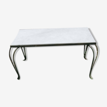 Coffee table with openwork metal base