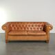 Sheepskin 2.5-seater Chesterfield sofa in a light cognac colour
