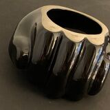 Black ceramic ashtray left hand