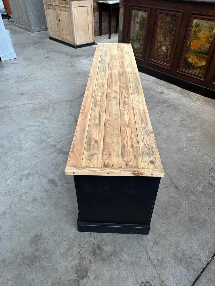 Old workshop furniture transformed into a TV unit.