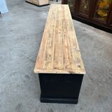 Old workshop furniture transformed into a TV unit.