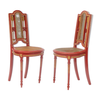 Pair of cane chairs decorated with arrows