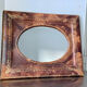 Antique leather framed mirror with gildings 30 cm x  24 cm