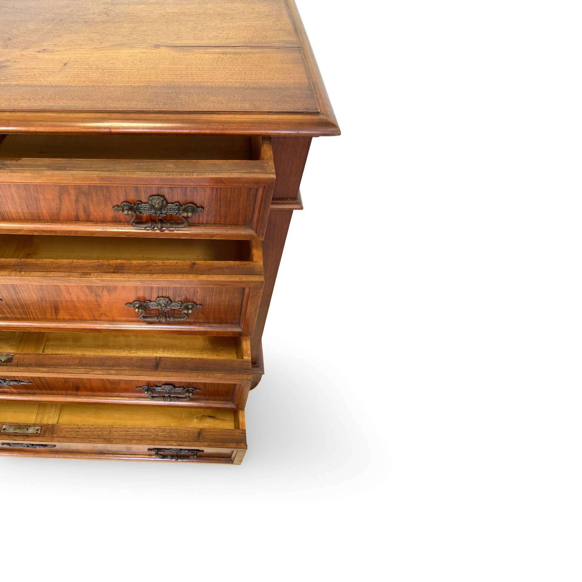Antique walnut commode with bronze handles in the shape of a lion's mask,