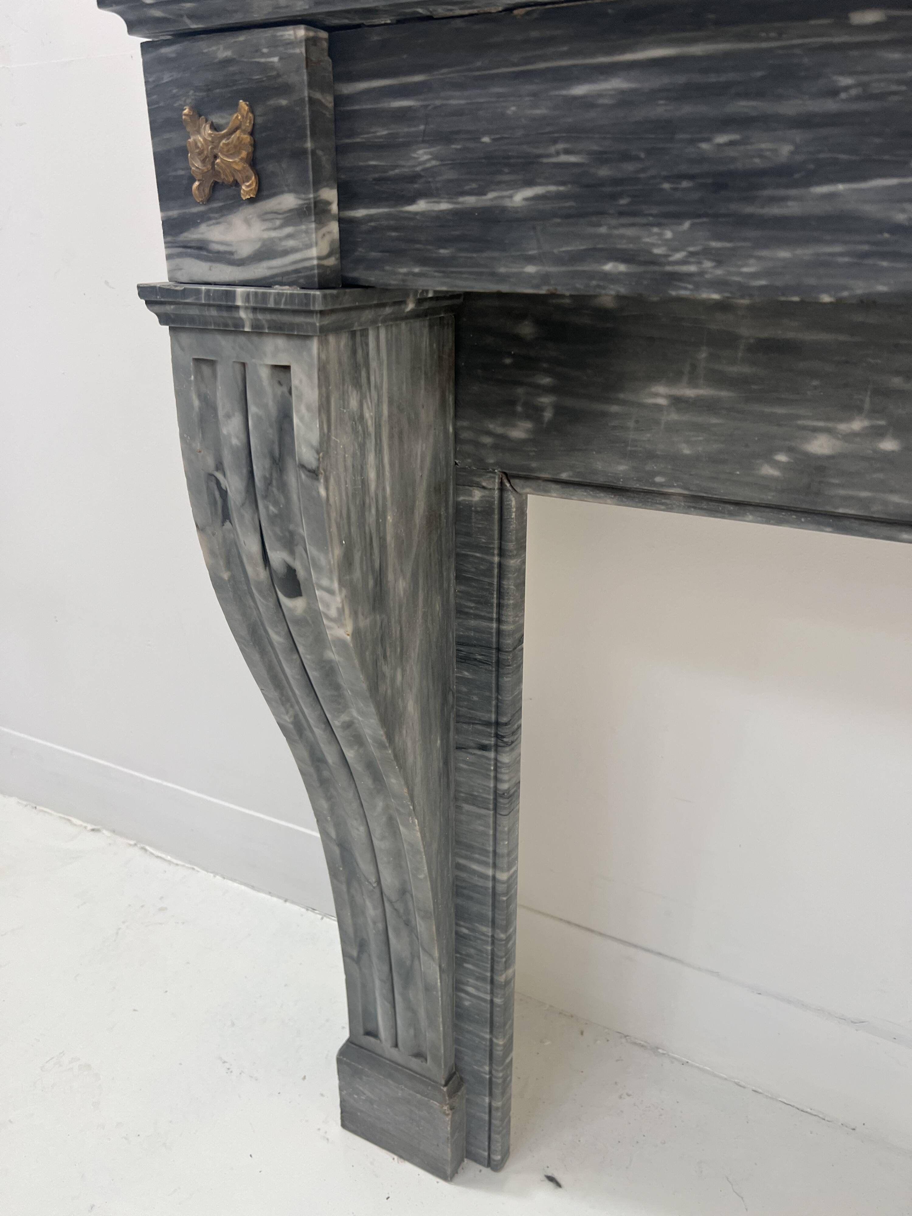Napoleon III fireplace in blue Turquin marble from the 19th century.