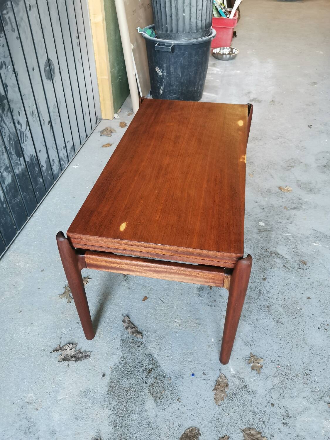 Vintage coffee table with Scandinavian rise and fall system in teak