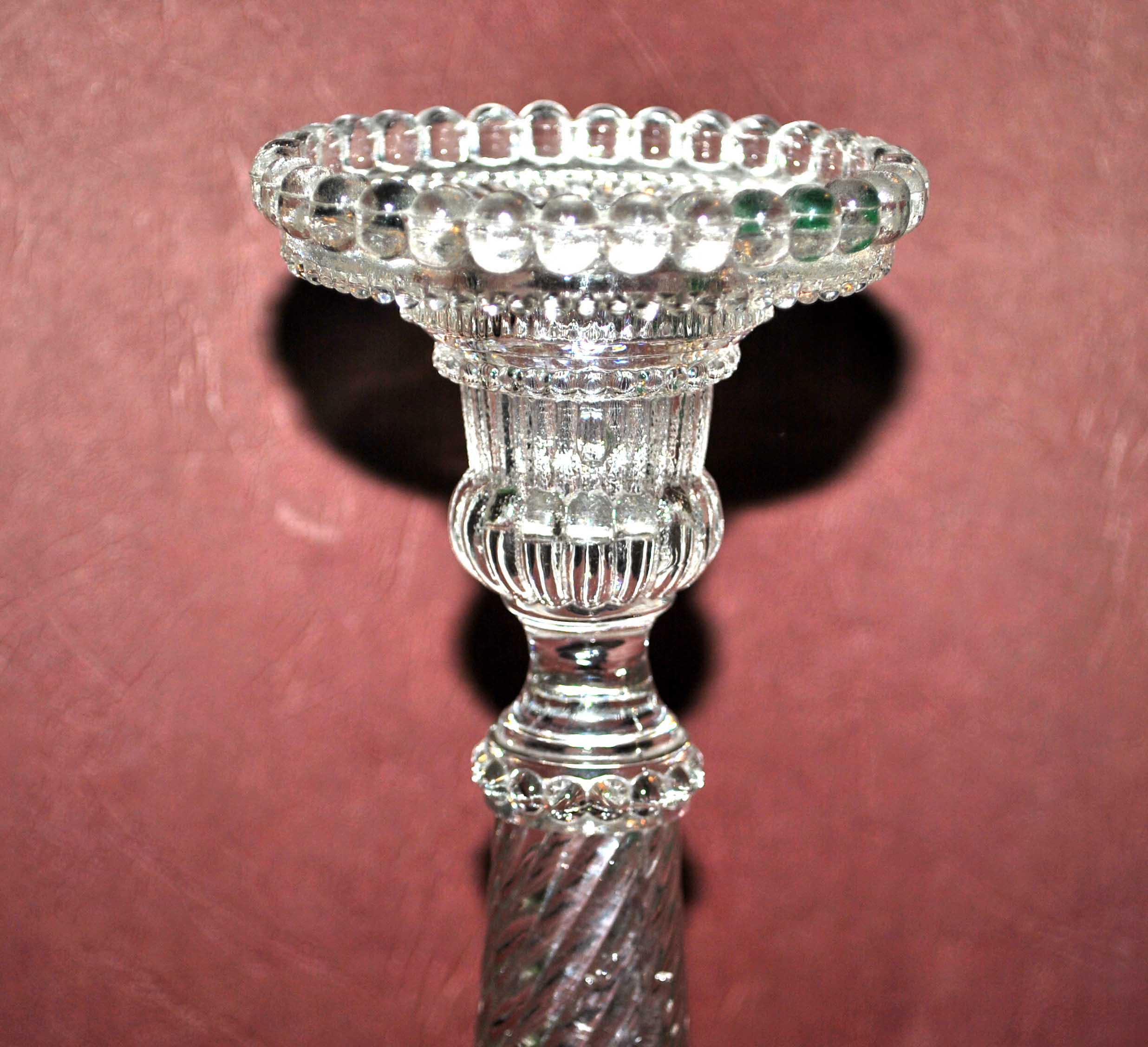 Old candlestick in molded glass of Portieux
