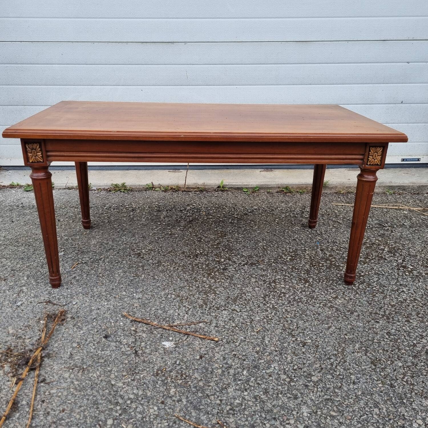 English wood coffee table with leather shelves