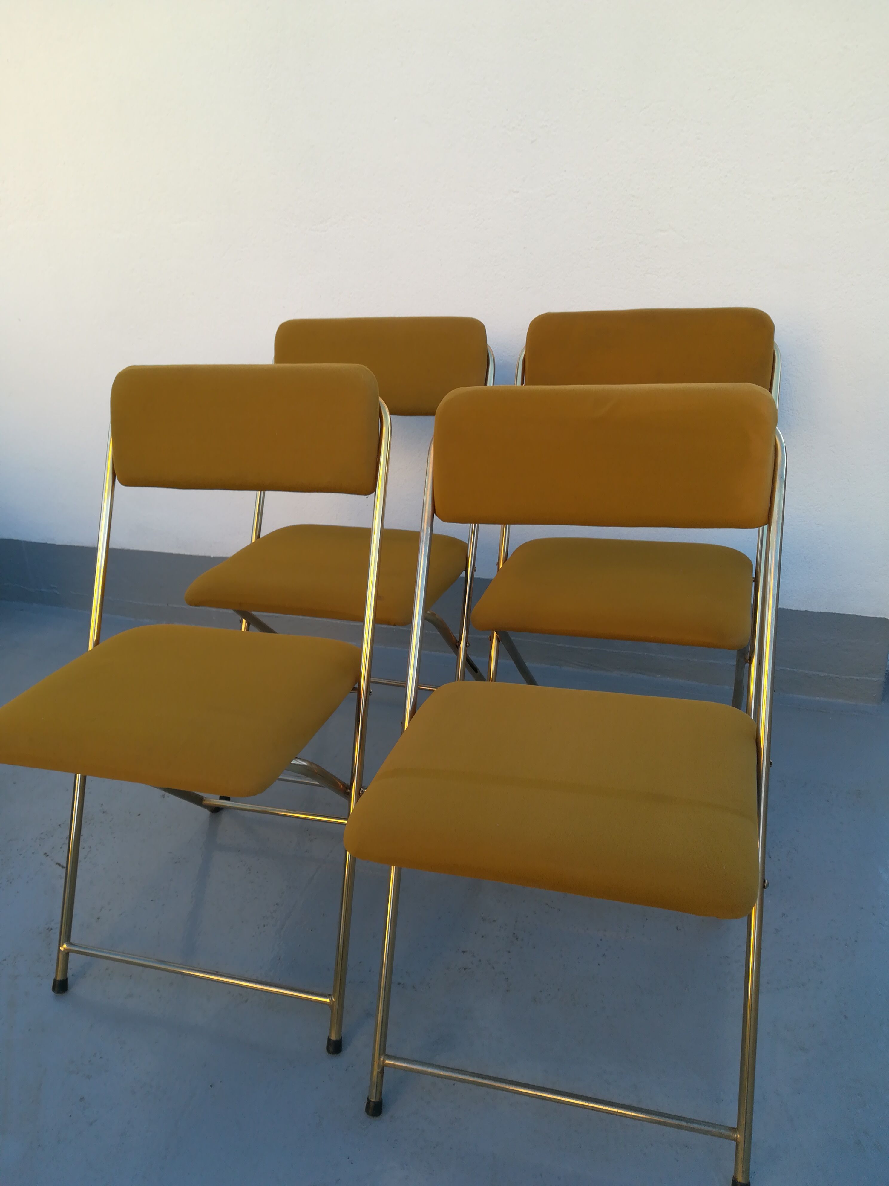 4 folding gold vintage Eyrel chairs