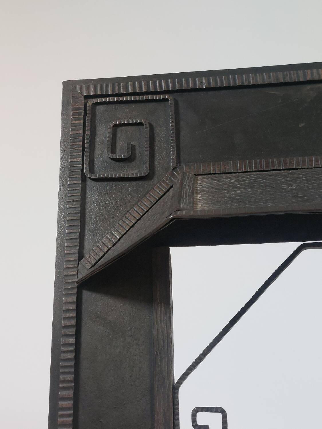 Hand-forged spiral decorative fire surround.