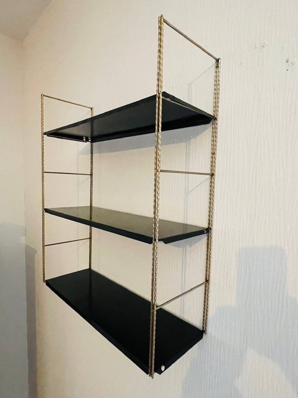 Adjustable vintage wall shelf in black metal and brass