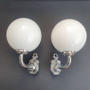 Pair of chrome wall sconces for bathroom with vintage fish pattern.